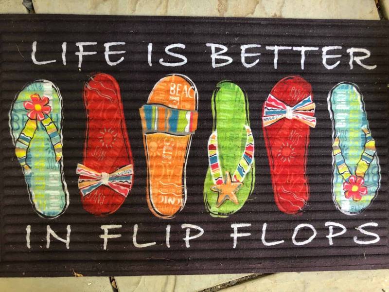 sign says life is better in flip flops