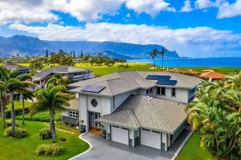 A view of house with the ocean and Bali Hai in the background.