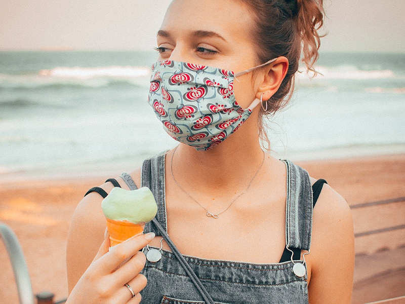 woman wearing mask on maui beach
