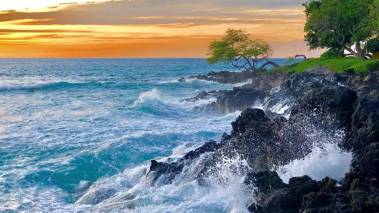 waves crash on shores of mauna kea resort