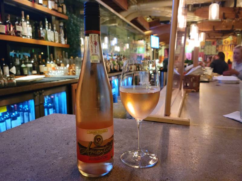 A bottle of Txakolina Rose at the Monkeypod bar.