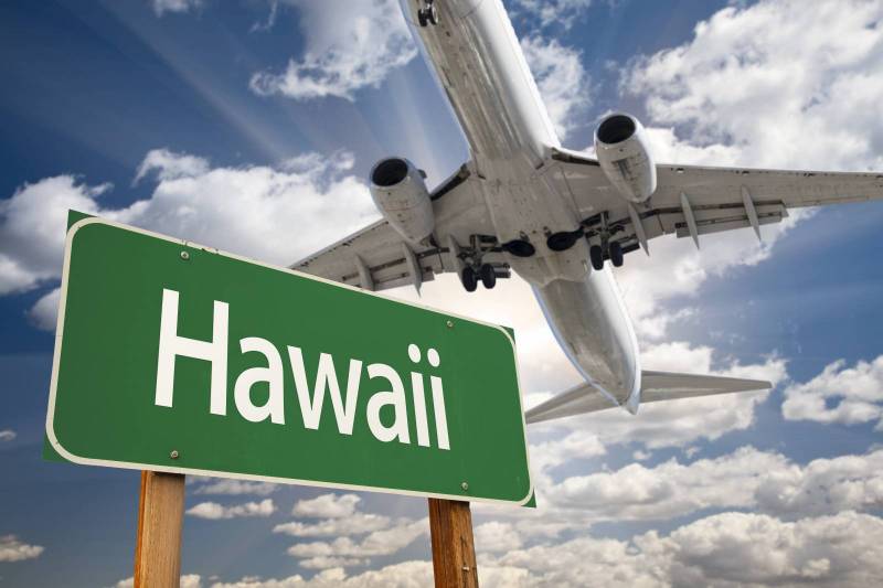 Hawaii sign with airplane