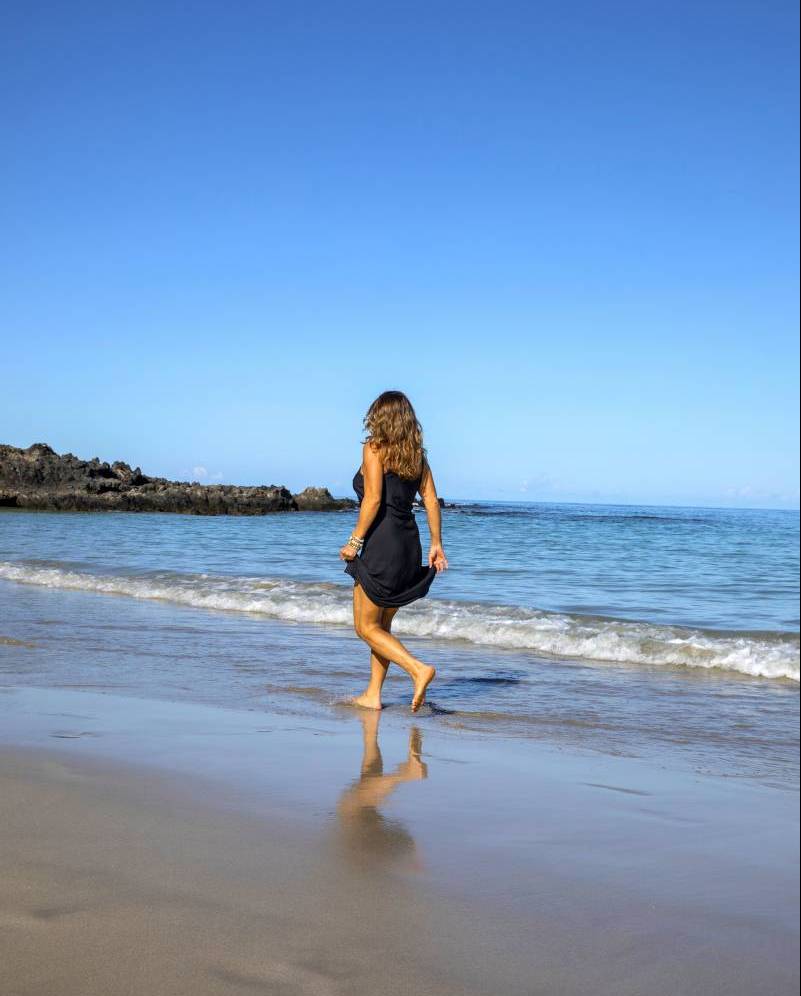 woman walking on hawaii beach