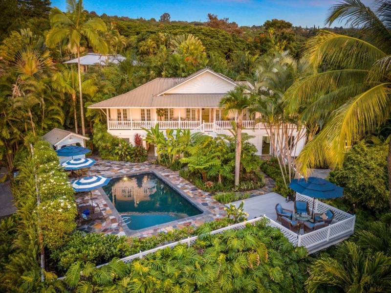 home with pool and tropical landscaping