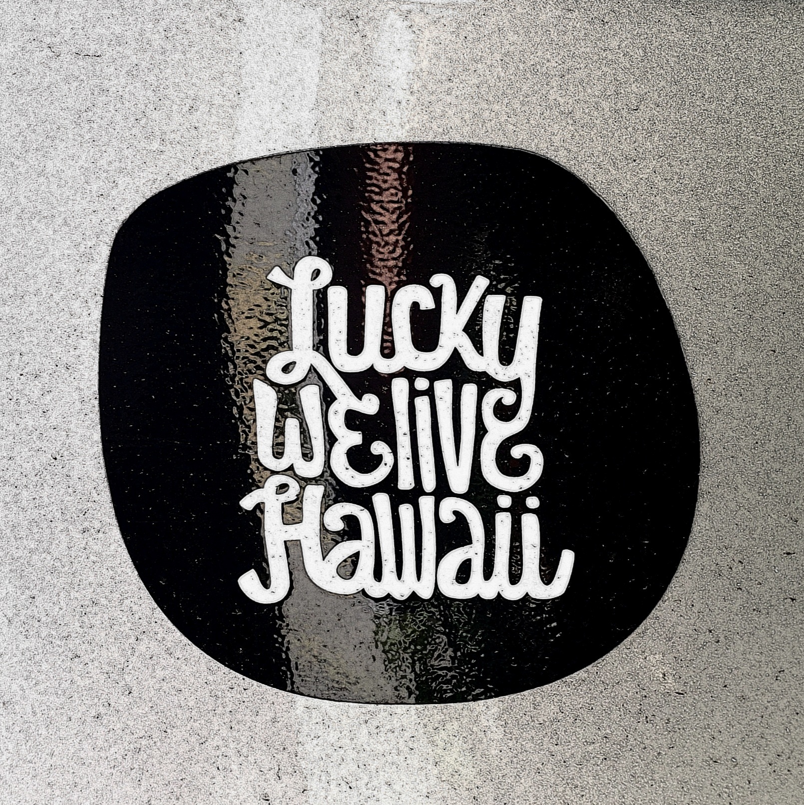 sticker reads "lucky we live hawaii"