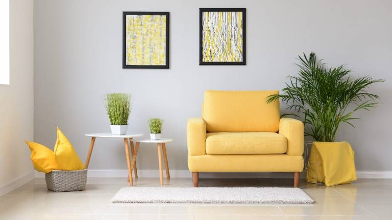 yellow chair in gray room
