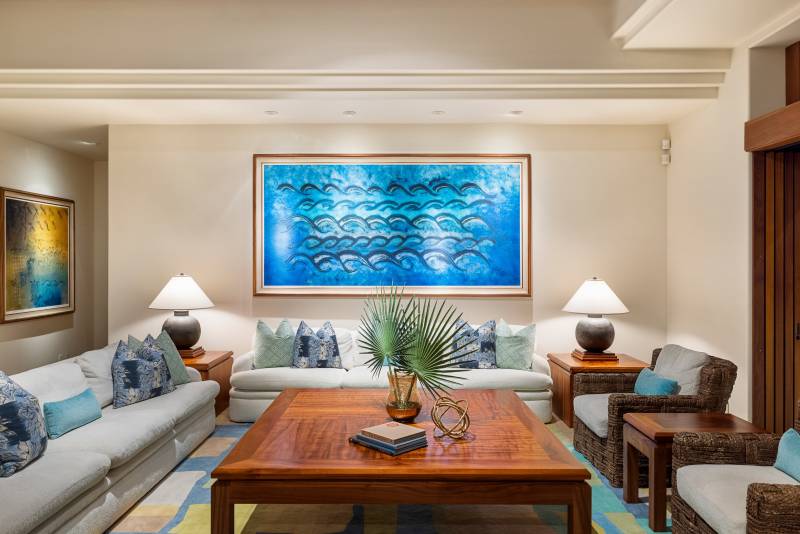 living room with blue waves painting