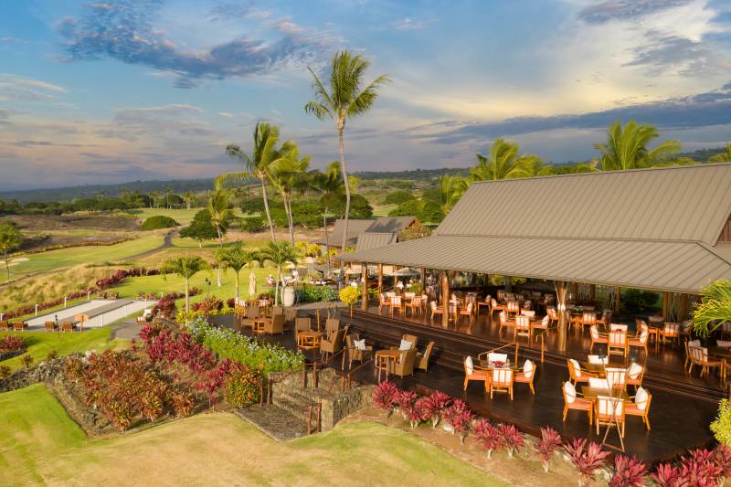 outdoor seating at the club at hokulia big island hawaii