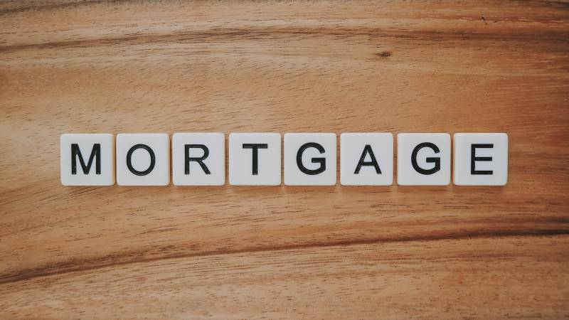 scrabble tiles spell out mortgage