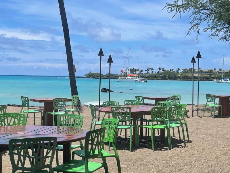 Tables at Lavalava Beach Club at Anaehoʻomalu Bay