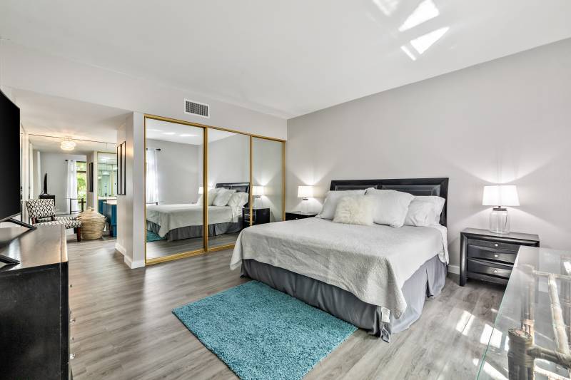 main bedroom with luxury vinyl plank flooring