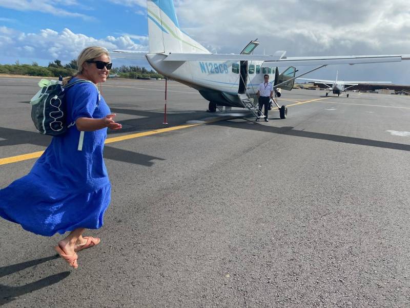 boarding a plan to molokai