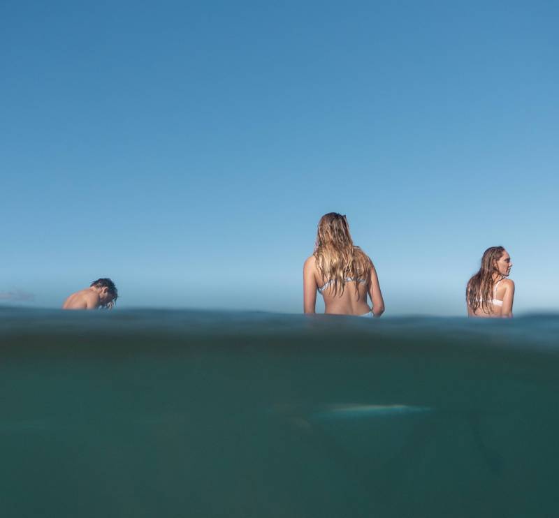 view if people on surfboards halfway in the water