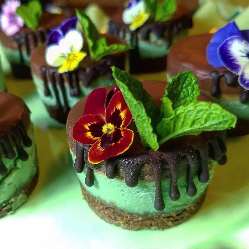 raw dessert topped with chocolate and edible flowers