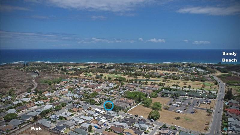 aerial view showing house and sandy beach