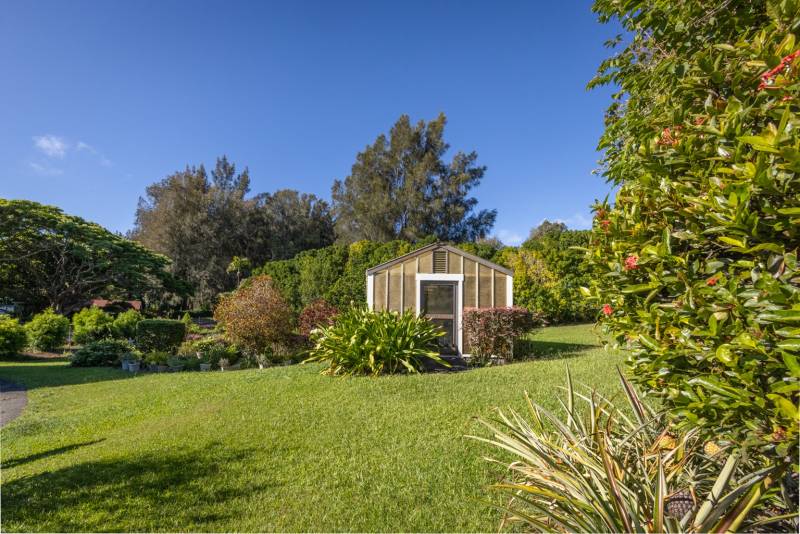 Greenhouse and extensive gardens at Maliu Ridge home