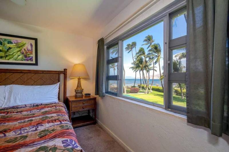 menehune shores condo bedroom with ocean views out the window