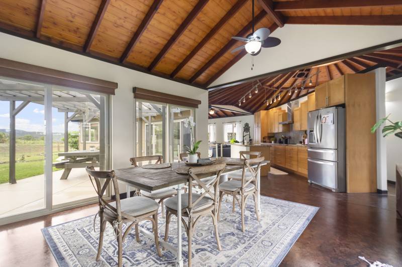 dining room in maui home with vaulted ceilings 