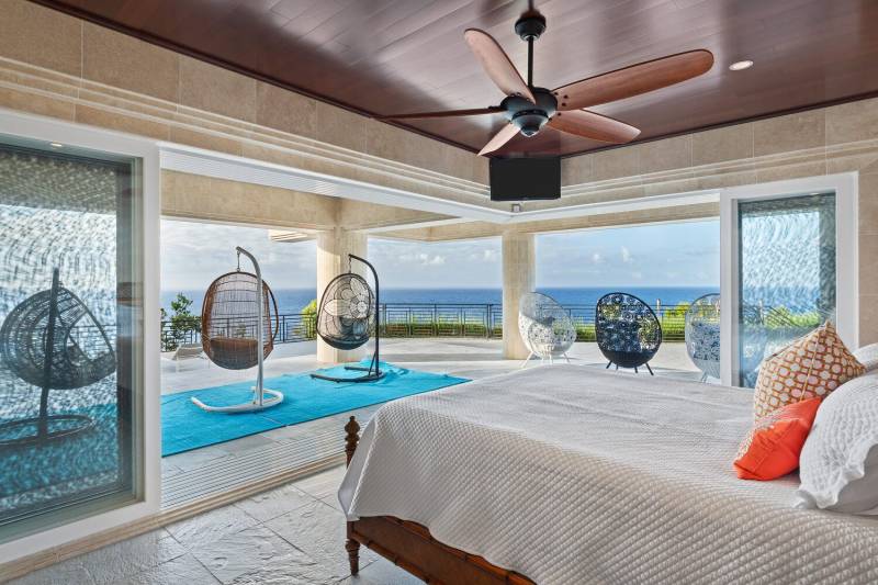 bedroom sliding doors open to ocean breezes