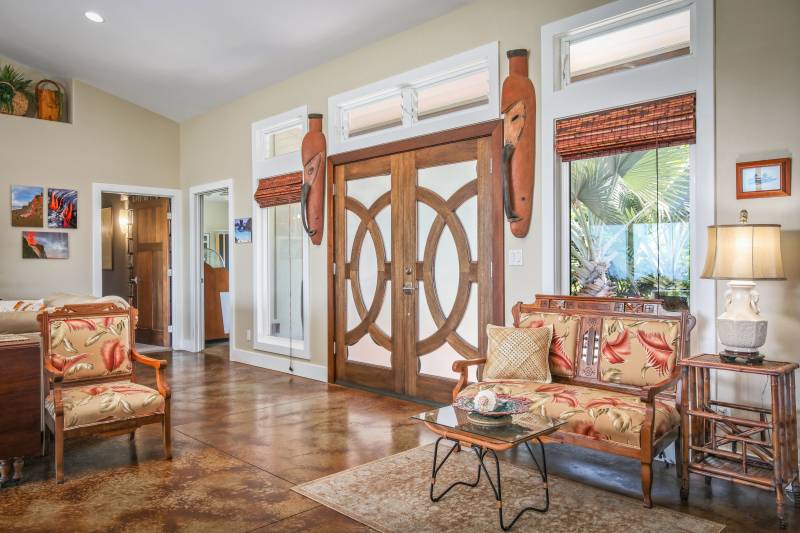 large decorative front doors featuring circular wood accents