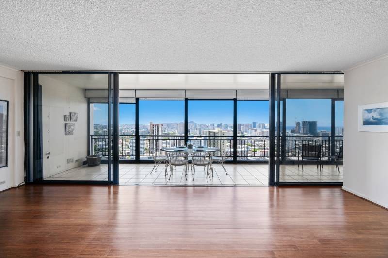 large sliding glass doors look out over honolulu
