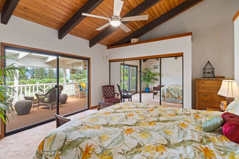 bedroom with glass doors to lanai
