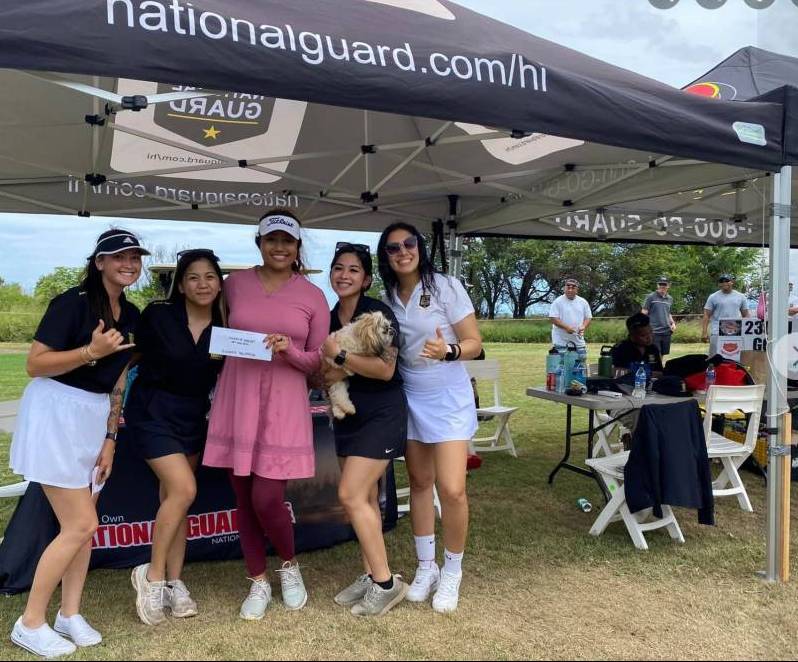 golfers pose for picture at national guard golf tournament