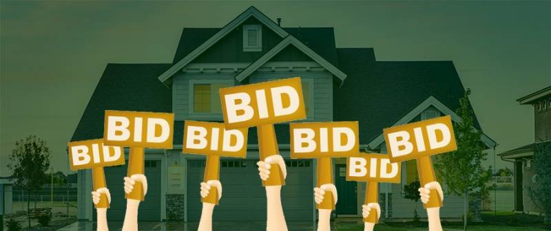hands holding signs that say bid