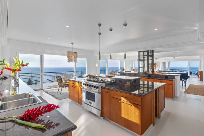 large kitchen with luxury appliances and wide ocean views 