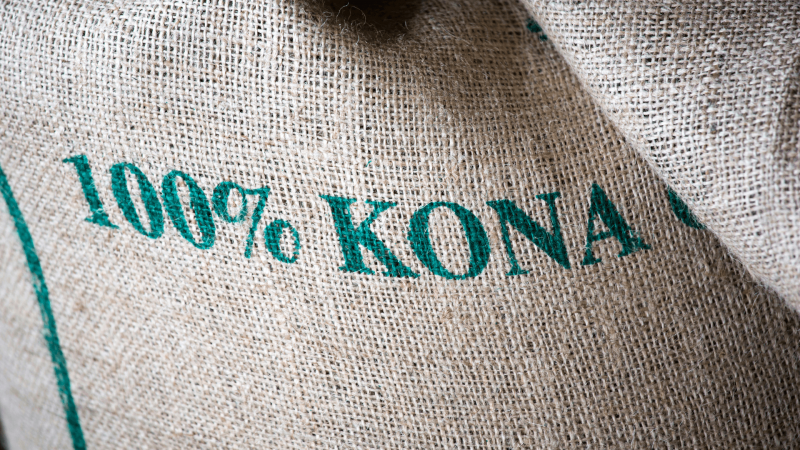 burlap bag filled with 100 perfect kona coffee beans