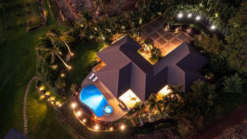 aerial overhead view of maui home at night with lights on 
