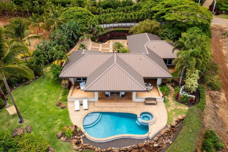 aerial view of maui home with swimming pool surrounded by tropical greenery
