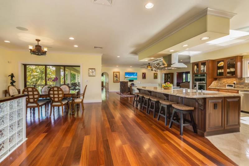 kitchen and dining are with large island with barstools