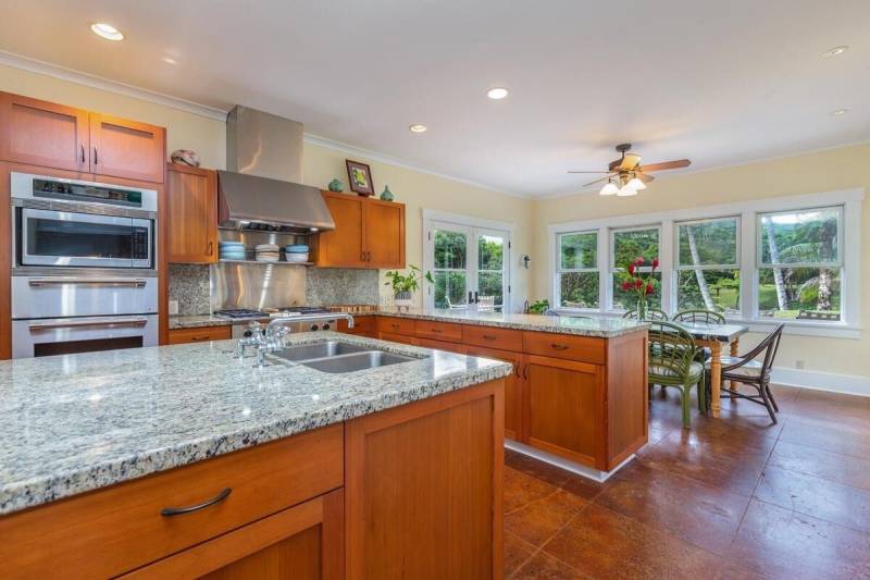 warm toned shaker style cabinets and granite countops in kitchen