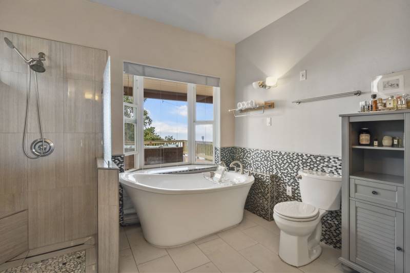 large soaking tub in master bathroom in maui home