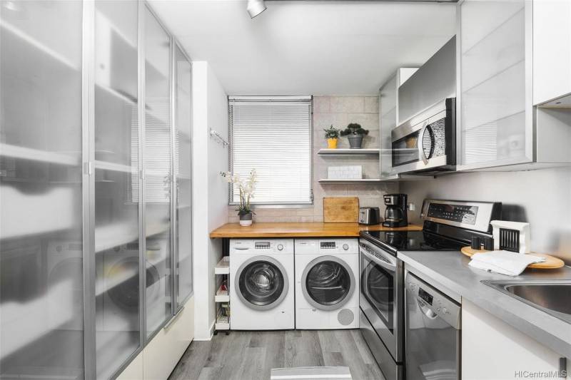 small kitchen with washer and dryer