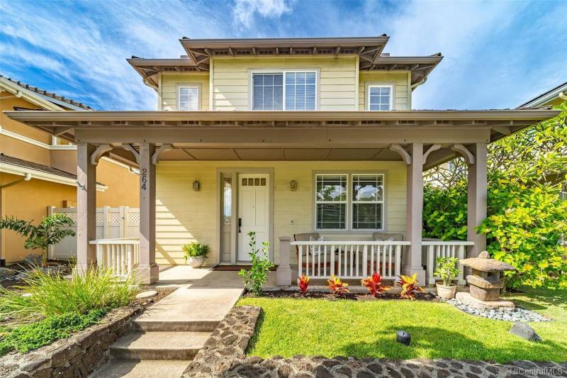 exterior of oahu home for sale with small patch of grass and steps leading to front door