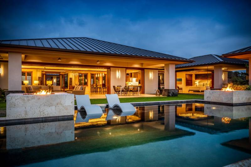 exterior of ocean view home and pool at night on big island hawaii