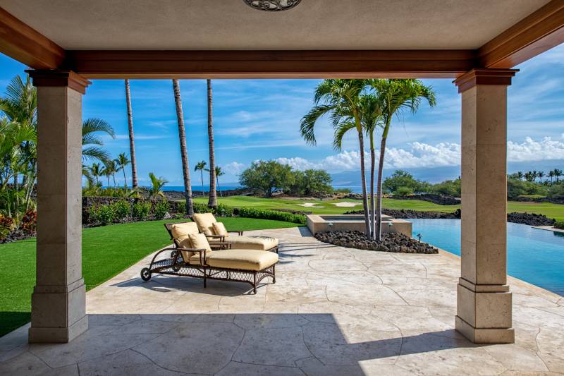 lounge chairs by beautiful ocean view pool at home in mauna lani resort big island