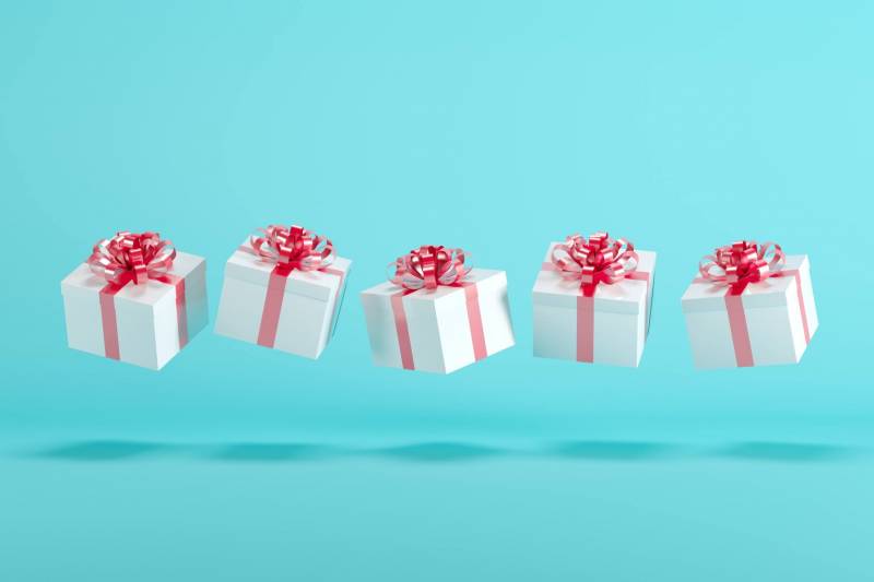white and pink presents on a light blue background