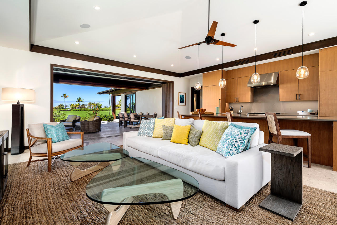 luxury residence with high ceilings and large sliding doors open to lanai