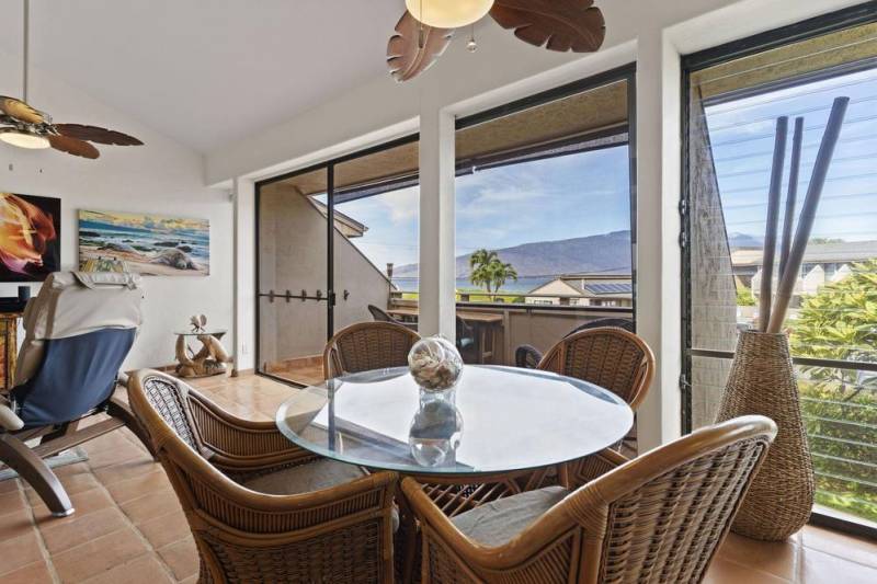 kitchen table and ocean views through sliding glass doors to lanai