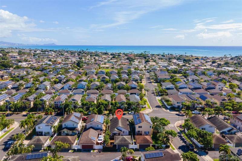 aerial view of ewa beach oahu neighborhod with arrow pointing to home for sale 