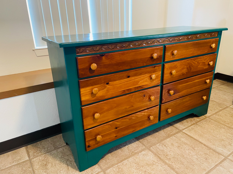 blue dresser with wood drawers