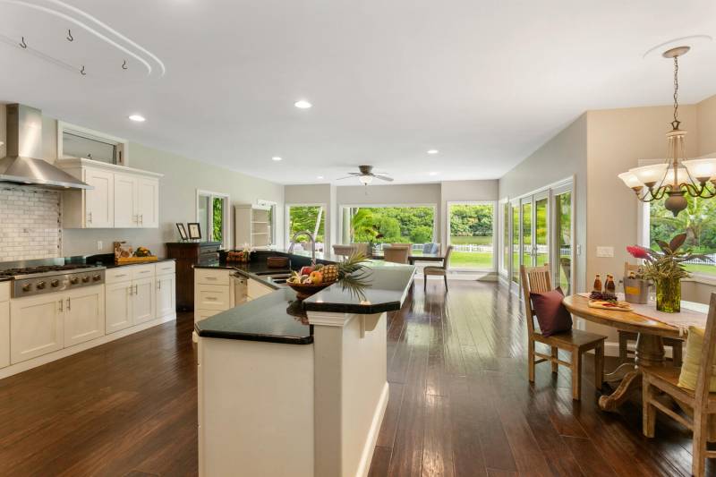 spacious kitchen and dining area with lots of natural light