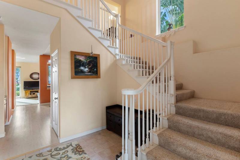 staircase with white bannister