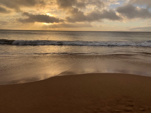maui beach at sunset on a cloudy day