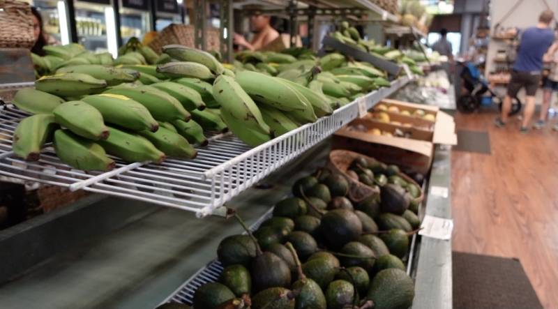 bananas and avocados at fruit market