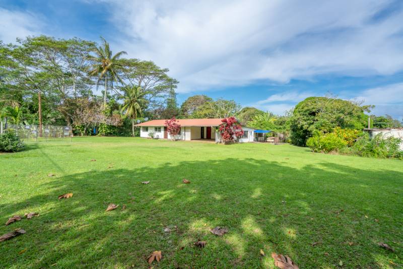 big island home with large grass yard