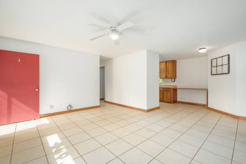 white tile in empty living room space 